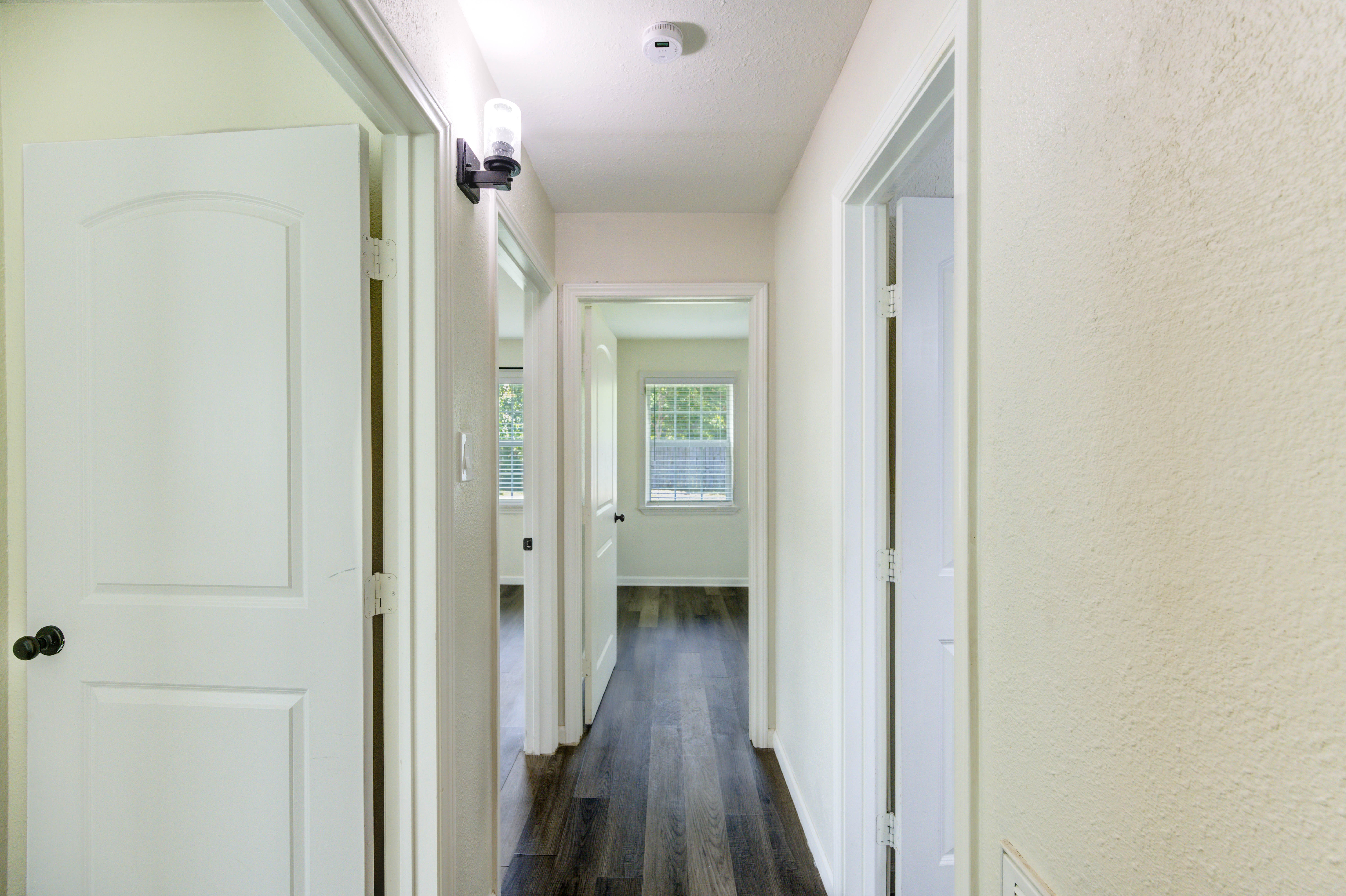 Hallway leading to bedrooms and bath