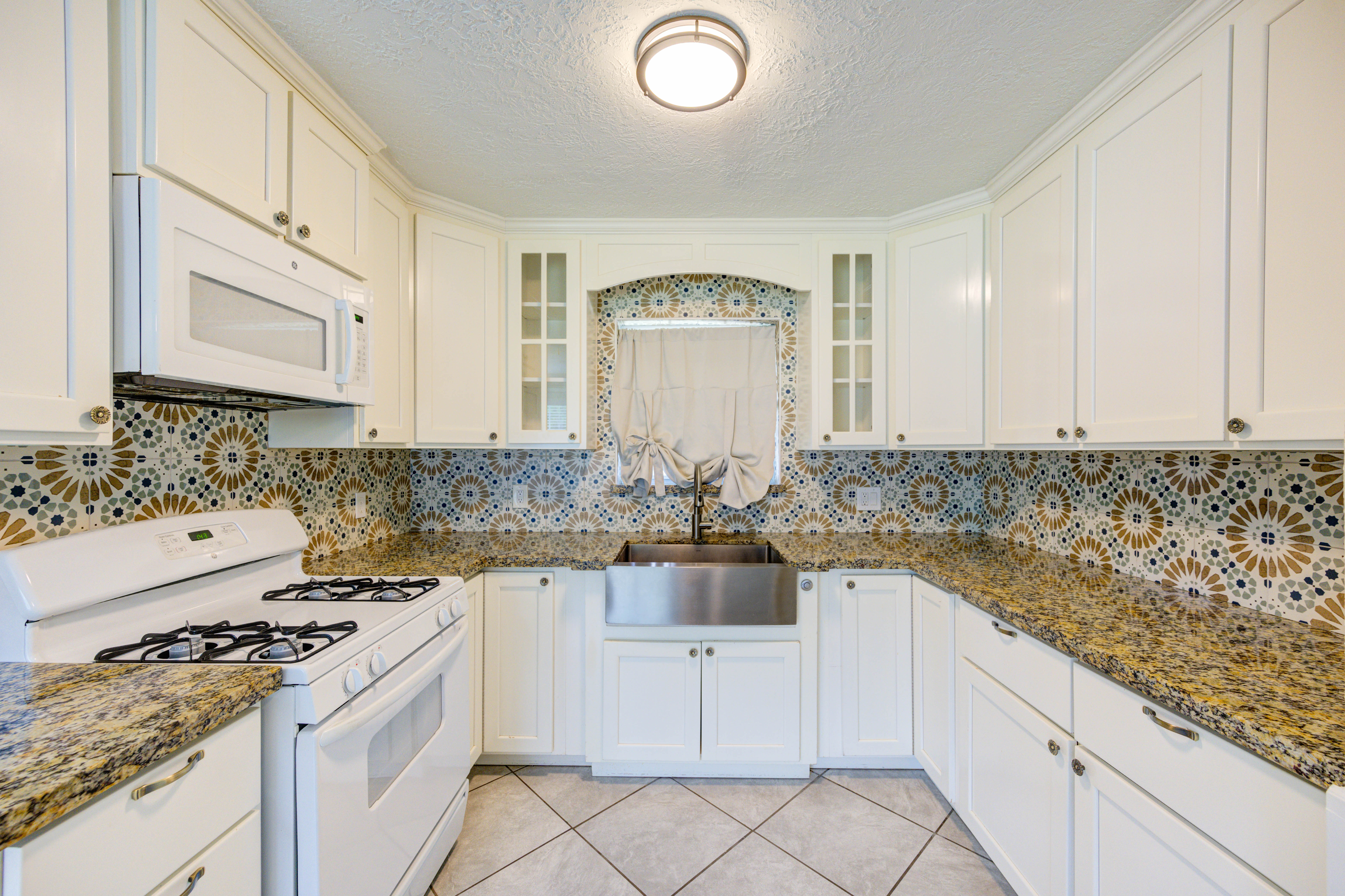 Kitchen with granite countertops and ample cabinetry