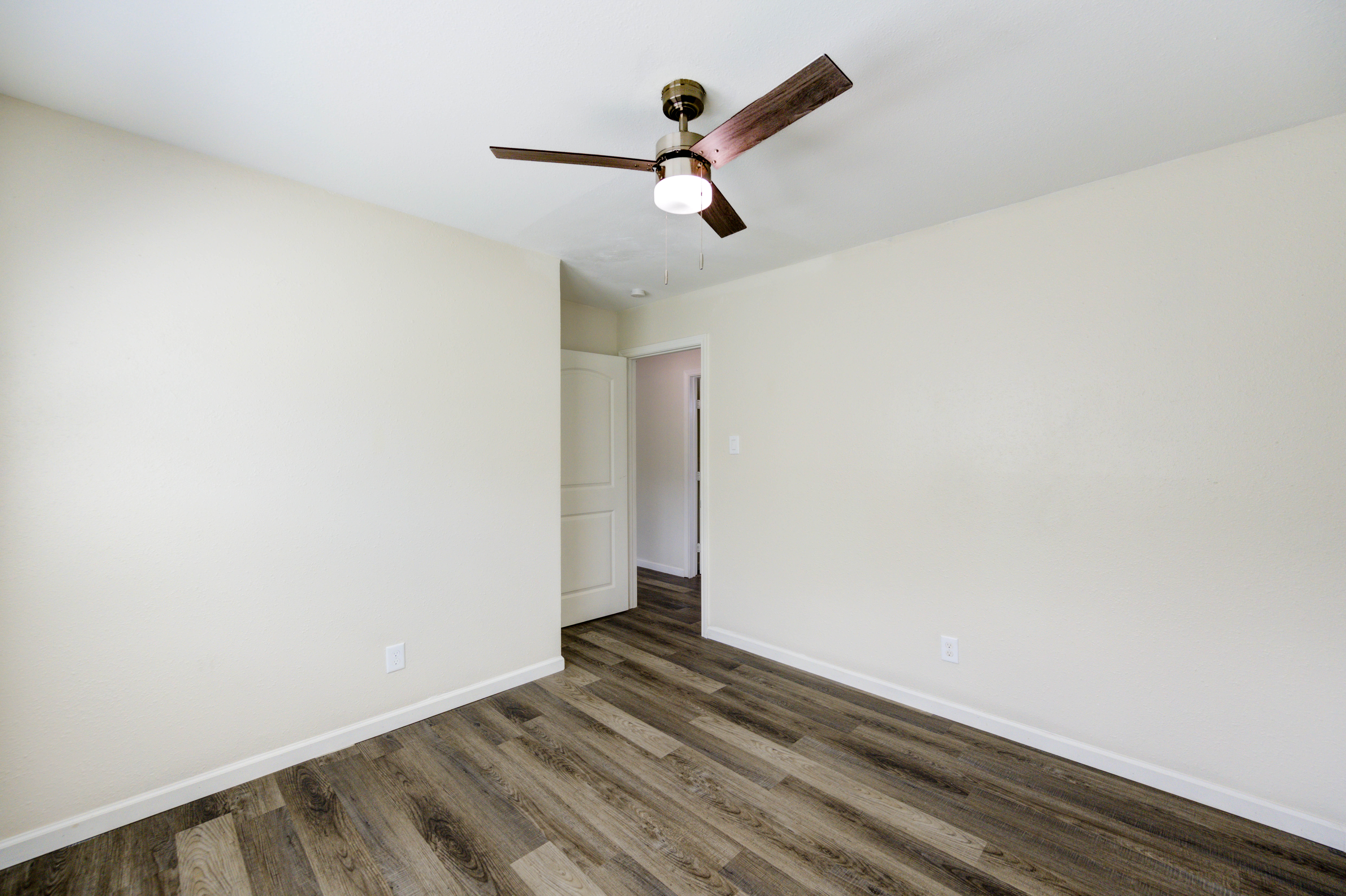 Bedroom with vinyl plank flooring