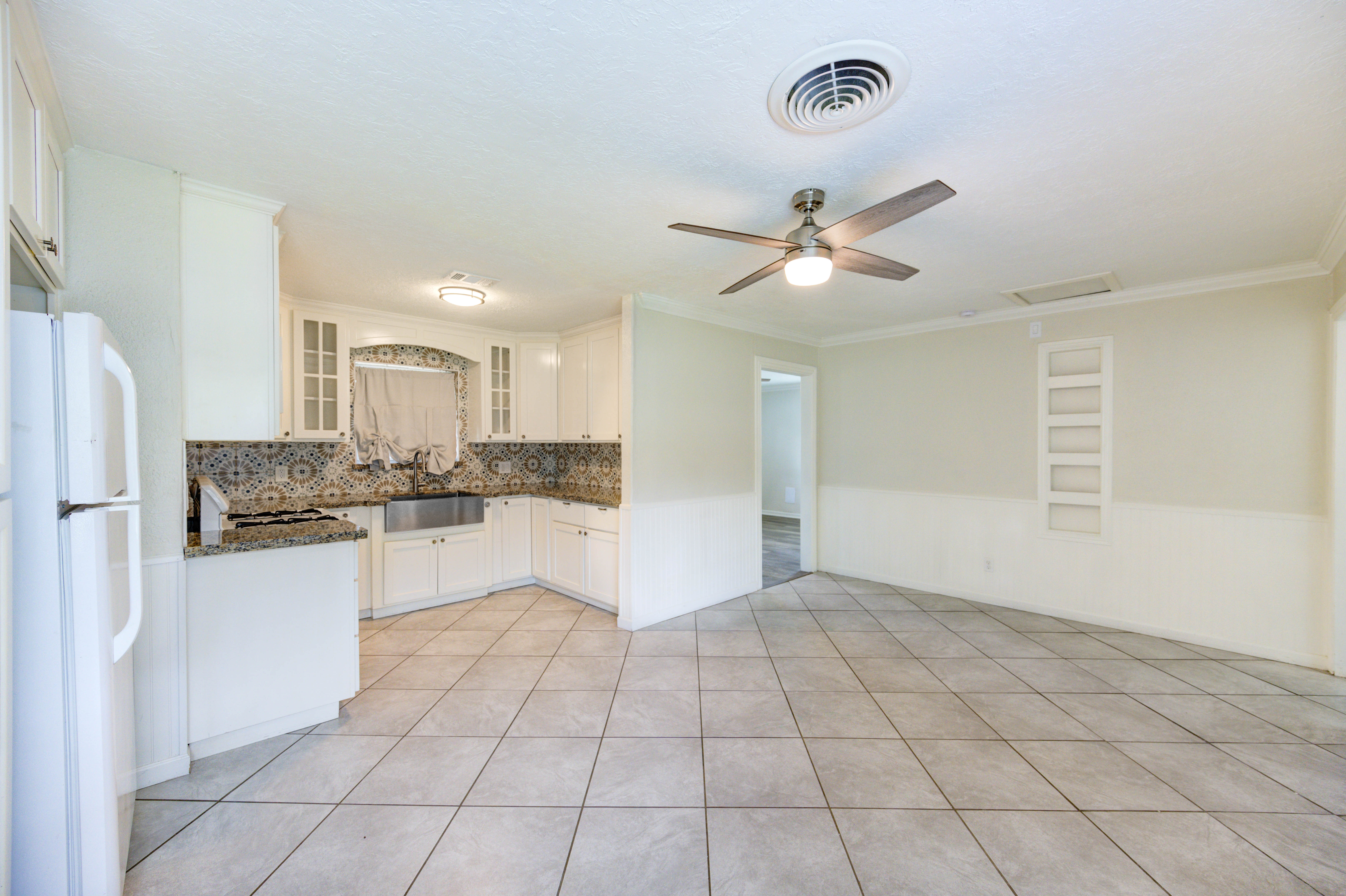 Kitchen and dining area with tile flooring