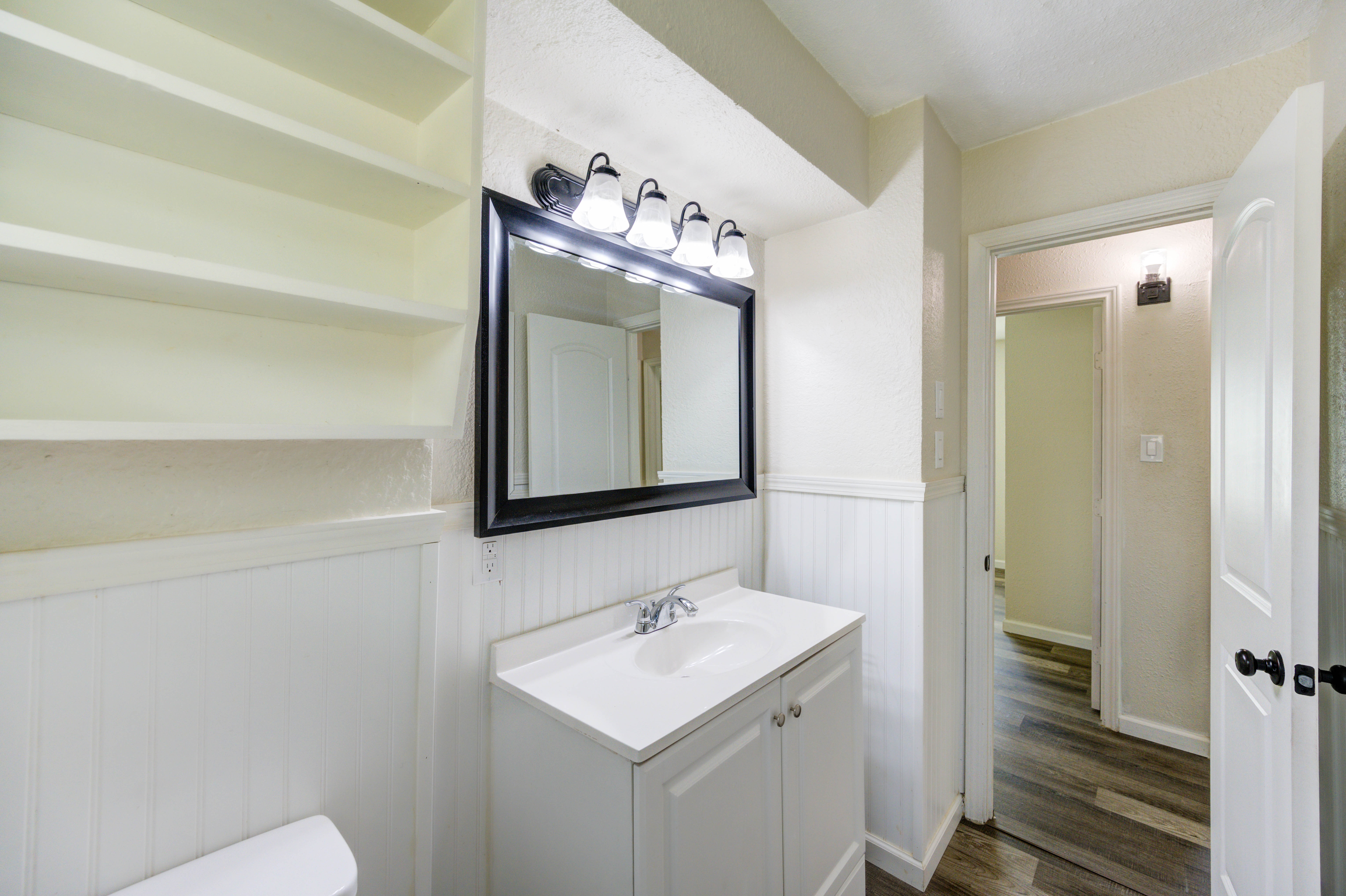 Bathroom vanity with additional shelving
